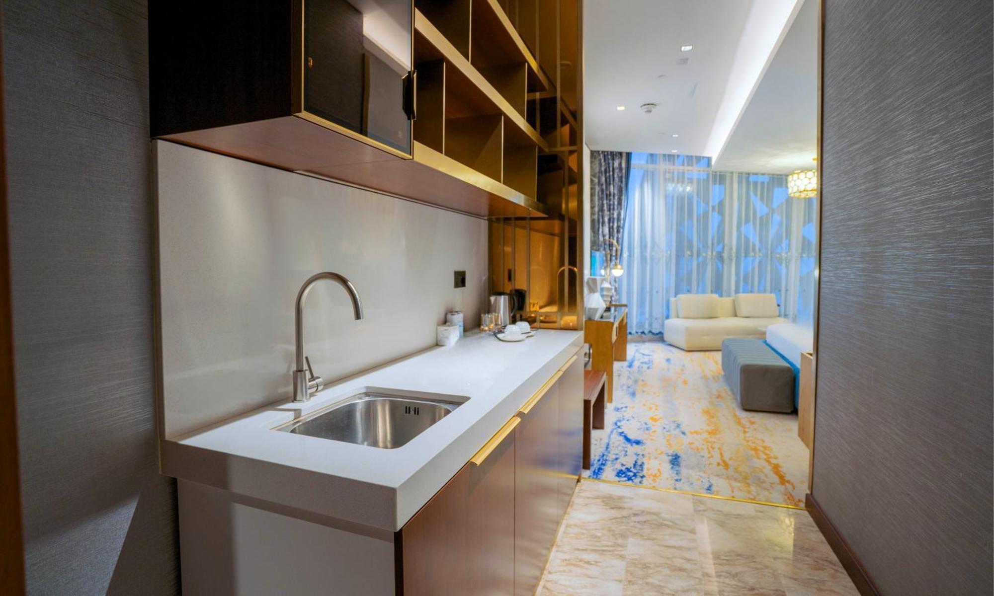 Velero Hotel Doha Lusail Exterior photo A kitchen in a hotel suite